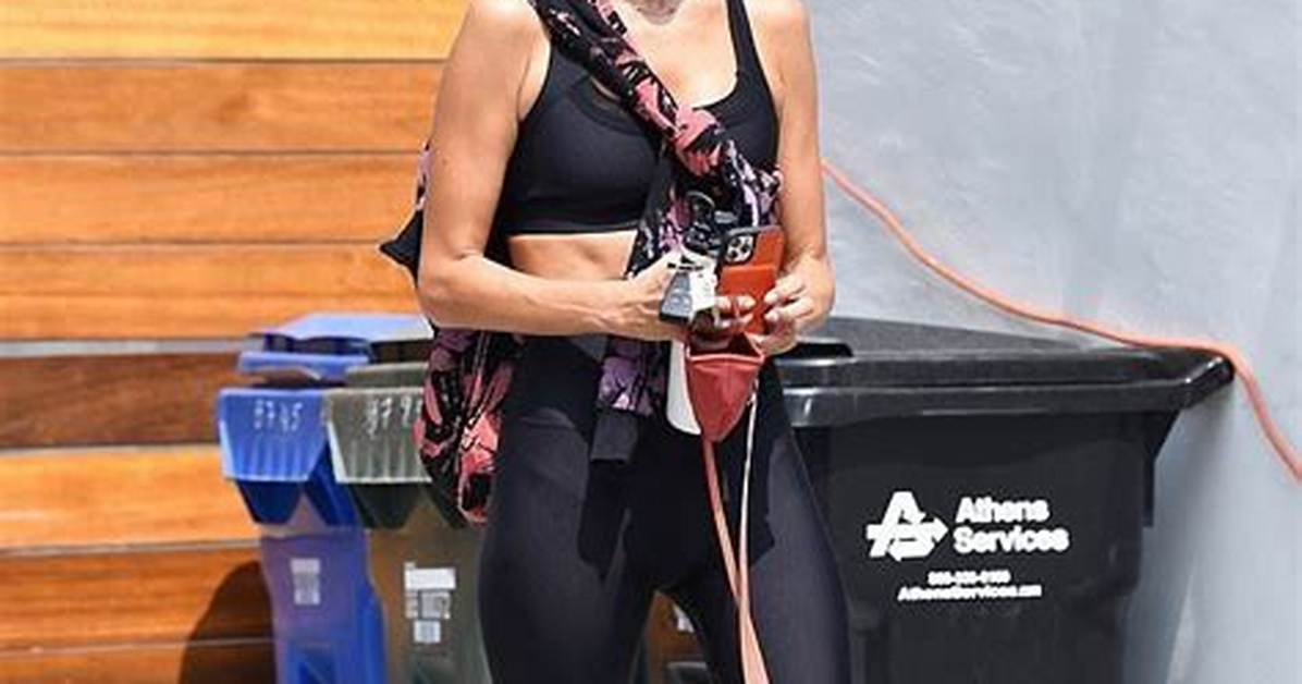 Alessandra Ambrosio, 39, Shows off Toned Abs in a Striped Bikini While Chilling with Her Kids