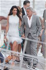 Amal Clooney Stuns in Ostrich Feather Dress Holding Hands with George in Lake Como: Photos