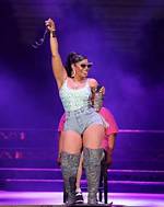 Ashanti Rocks Daisy Dukes & Thigh-High Boots for Concert – Hollywood Life