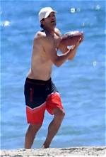 Ashton Kutcher Plays Football on the Beach Shirtless with Mila Kunis After Health Scare