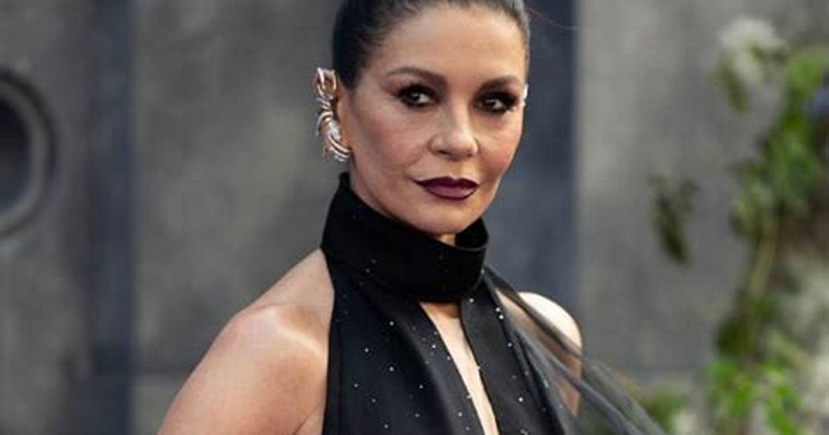 Catherine Zeta-Jones Looks Gorgeous in Black Dress with High Slit at Golden Globes