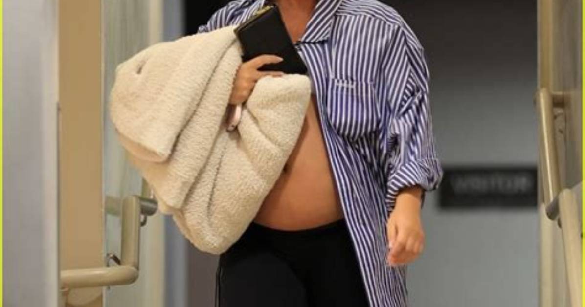 Chrissy Teigen Bares Baby Bump in Black Crop Top for Family Movie Date: Photo