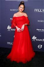 Chrissy Teigen Hiding Her Bump in Fabulous Outfits — Pics