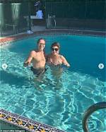 Dame Joan Collins, 89, Rocks Leopard Swimsuit for Swim with Husband Percy Gisbon, 57