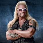 Dog the Bounty Hunter Holds up Newspaper to Prove He’s ‘Alive’ After Rumors He Had a 2Nd Pulmonary Embolism