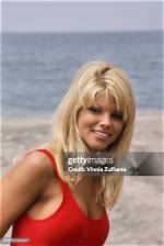 Donna D’errico Rocks Red ‘Baywatch’ Swimsuit to Celebrate Her 55Th Birthday in Sexy Photo