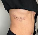 Enchanting Floral Rib Tattoos: a Symphony of Delicate Designs