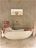 Gwyneth Paltrow Bathes in a Tub of Milk Wearing an All-White Bikini in Wild New Photo