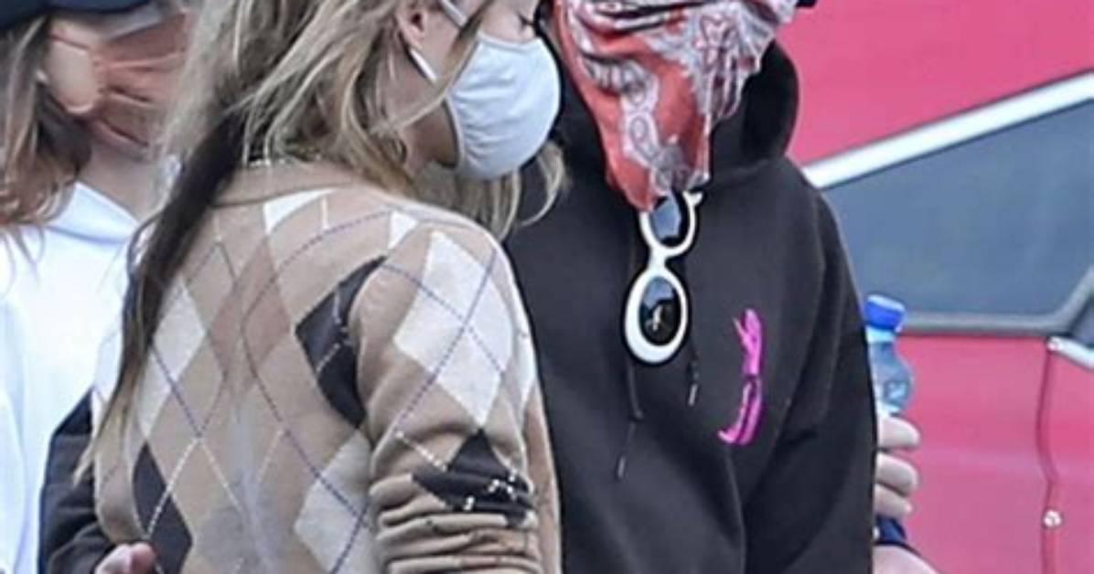 Harry Styles Wraps an Arm Around Olivia Wilde as They Hang with Pals After Wedding Date