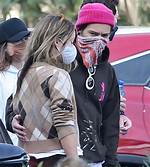 Harry Styles Wraps an Arm Around Olivia Wilde as They Hang with Pals After Wedding Date