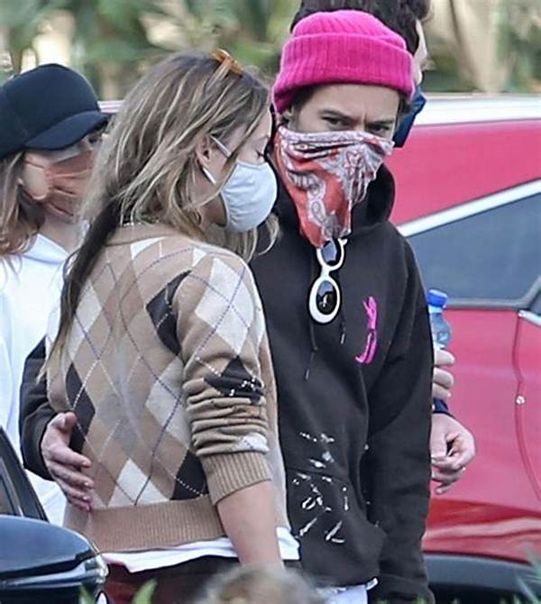 Harry Styles Wraps an Arm Around Olivia Wilde as They Hang with Pals After Wedding Date