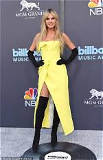 Heidi Klum Stuns in a High Slit ‘Bikini’ Gown on Her Way to the Jean Paul Gautier Couture Show