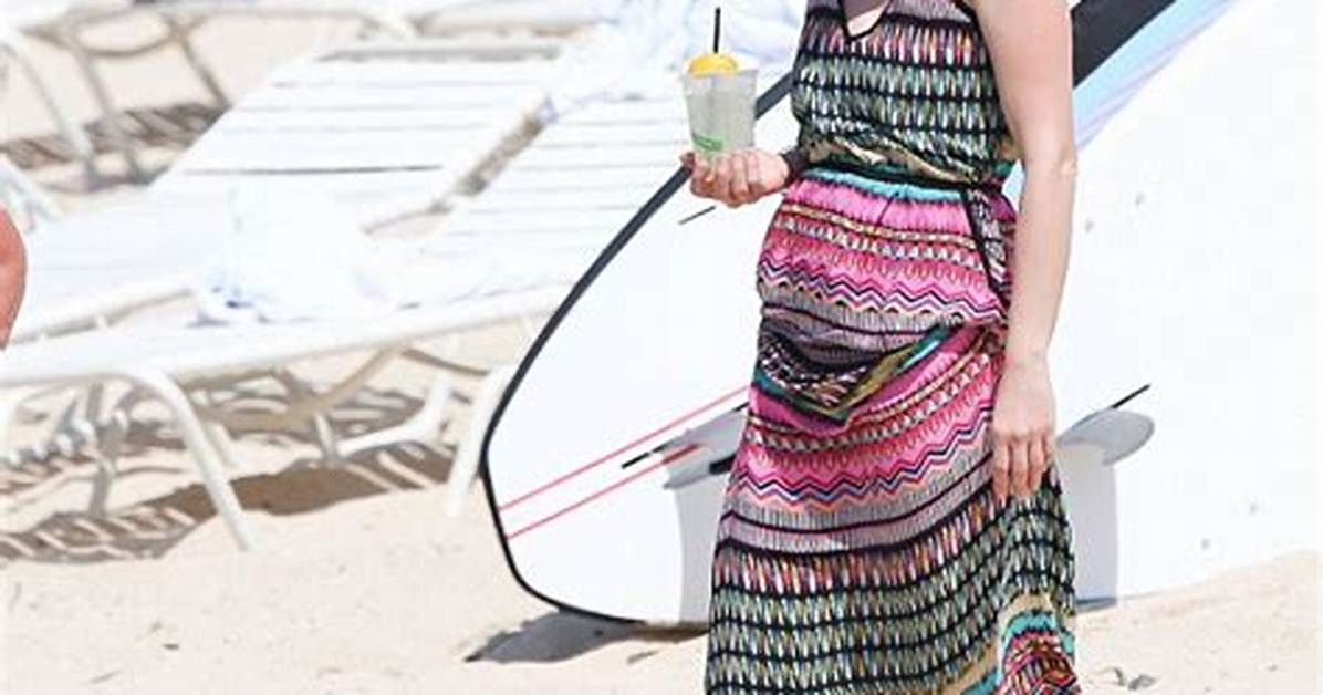 January Jones, 45, Soaks up the Sun in a Sexy White Scallop Bikini: Watch