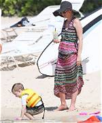 January Jones, 45, Soaks up the Sun in a Sexy White Scallop Bikini: Watch