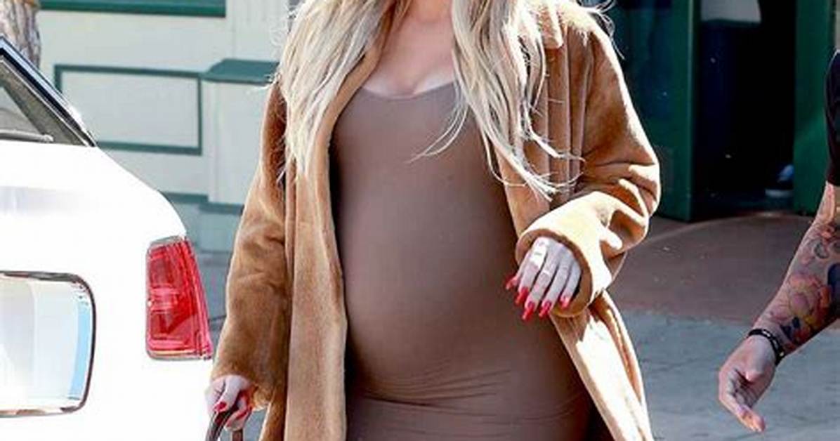 Khloe Kardashian Shows off Baby Bump in Tight White Dress Just Like Sis Kim Kardashian