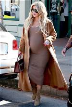 Khloe Kardashian Shows off Baby Bump in Tight White Dress Just Like Sis Kim Kardashian