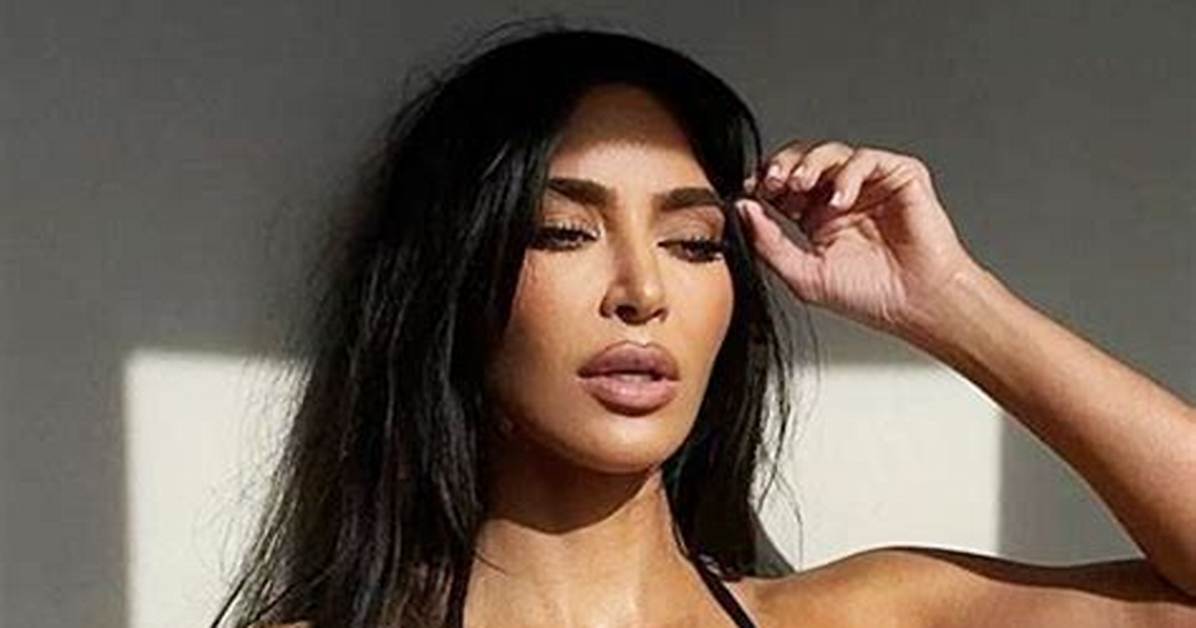 Kim Kardashian Rocks a Black Bikini to Sunbathe on a Hammock in the Water