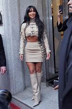 Kim Kardashian Sizzles in Beige Crop Top & High Slit Skirt for Revolve’s Coachella Party: Photos