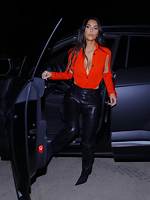 Kim Kardashian Wears Leather Pants & Unbelievable Cutout Shirt in Sexy, New Photoshoot