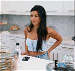Kourtney Kardashian Shows How to Pair a Black Strapless Top with Dark Jeans for an Elongating Look
