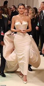 Kylie Jenner Poses in Stunning White Gown with Plunging Neckline After Reuniting with Drake