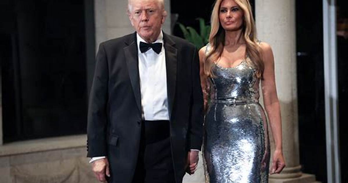Melania Trump’s Chest Looks Huge in Tight Raincoat Amidst Speculation She Got a Boob Job