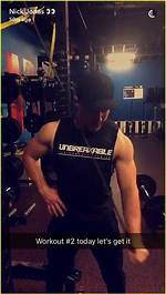 Nick Jonas Shows off His Strength While Doing Push-Ups with Priyanka Chopra on His Back — Pic