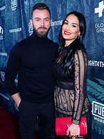 Nikki Bella Slays White Crop Top, Skirt & ‘Wife’ Hair Clip After Marrying Artem in Paris: Photos