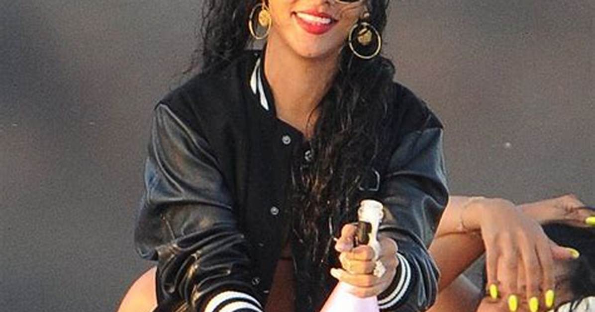 Rihanna Sizzles in a Black & White Bikini While Poolside Next to Her ‘Queen Sized’ $1,495 Book