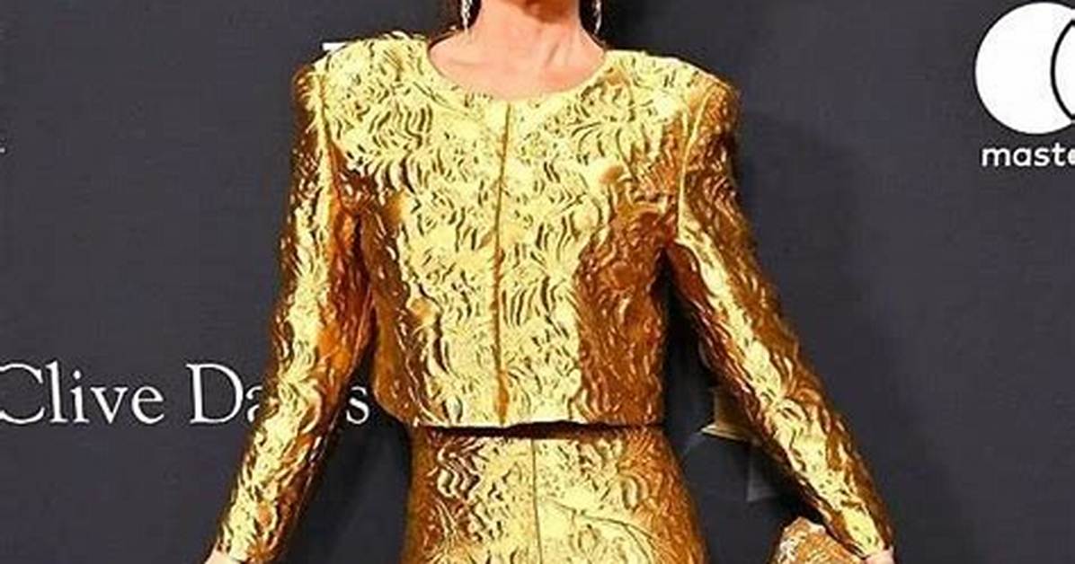 Shania Twain Looks Fabulous in a Metallic Gold Pantsuit & Cowboy Hat at Pre-Grammys Party