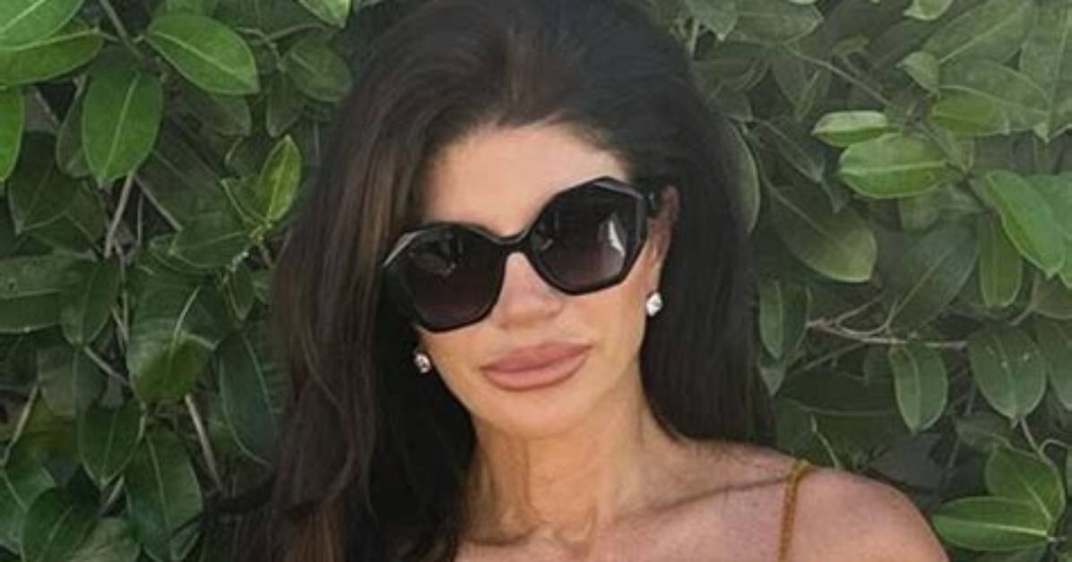 Teresa Giudice, 48, Rocks Sexy Plunging Mini Dress While Cozying up to Bf Louie Ruelas on Nye